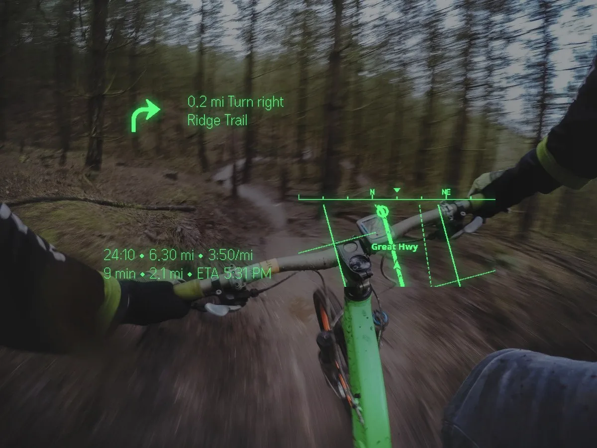 Handlebars on a forest trail: turn right onto Ridge Trail in 0.2 mi, 24:10 elapsed, 6.30 mi at 3:50 a mile, 9 min and 2.1 mi to go, ETA 5:31 PM, and a mini-map with your heading.
